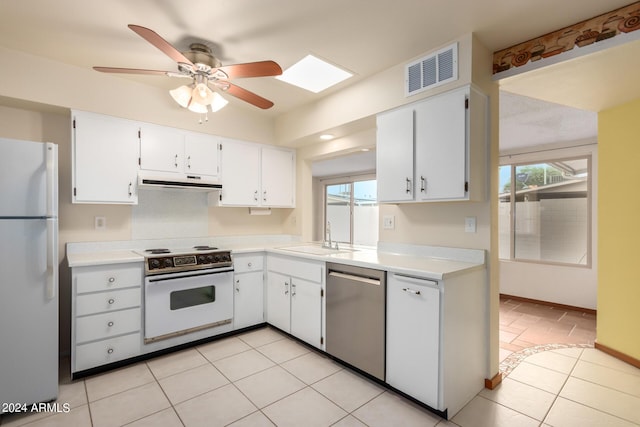 kitchen featuring ceiling fan, sink, white cabinets, light tile patterned flooring, and white appliances