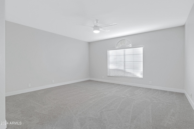 unfurnished room with ceiling fan and carpet floors