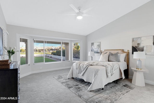 carpeted bedroom featuring ceiling fan and lofted ceiling