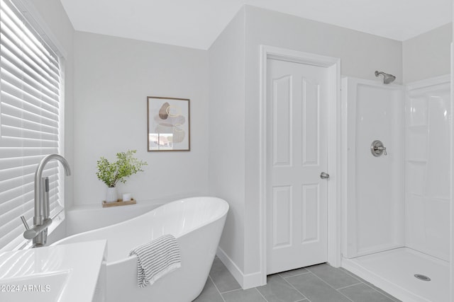 bathroom featuring separate shower and tub and tile patterned floors