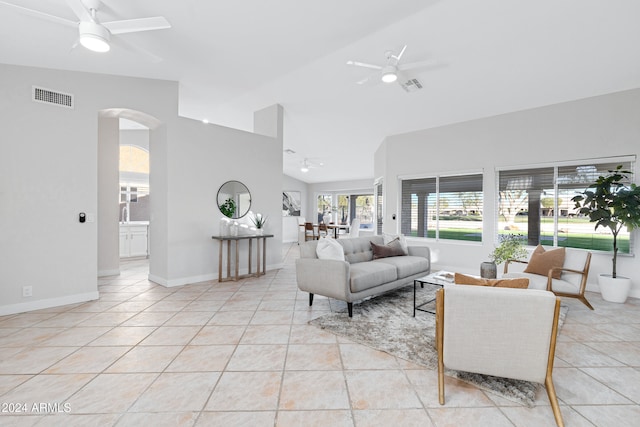 living room with high vaulted ceiling, ceiling fan, and light tile patterned flooring