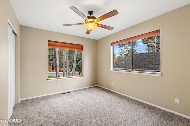 69 E Mohawk Dr, Flagstaff, AZ 86005 - empty room featuring carpet flooring, a ceiling fan, and baseboards