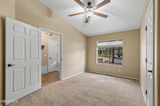 69 E Mohawk Dr, Flagstaff, AZ 86005 - unfurnished bedroom featuring vaulted ceiling, carpet, baseboards, and a ceiling fan