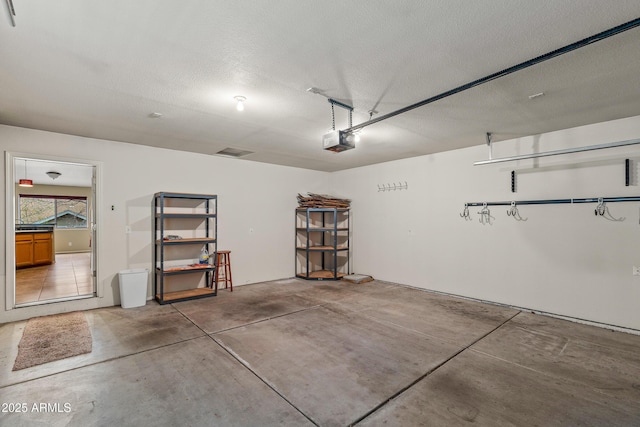 69 E Mohawk Dr, Flagstaff, AZ 86005 - garage featuring a garage door opener