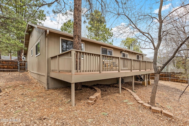 69 E Mohawk Dr, Flagstaff, AZ 86005 - rear view of house with a fenced backyard and a wooden deck