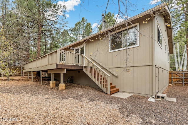 69 E Mohawk Dr, Flagstaff, AZ 86005 - back of property featuring stairway, fence, and a deck