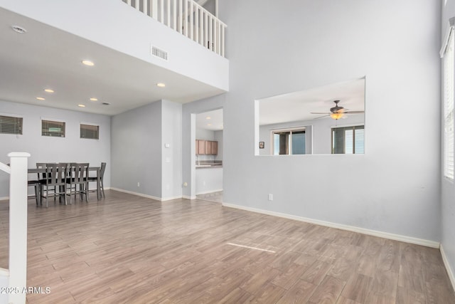 20261 W Desert Bloom St, Buckeye, AZ 85326 - living area with visible vents, wood finished floors, baseboards, ceiling fan, and recessed lighting