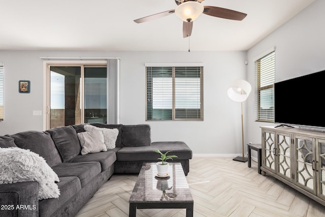 20261 W Desert Bloom St, Buckeye, AZ 85326 - living area with a ceiling fan and baseboards