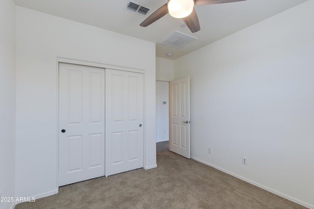 14870 W Encanto Blvd Unit 2006, Goodyear, AZ 85395 - unfurnished bedroom featuring carpet, a closet, and a ceiling fan