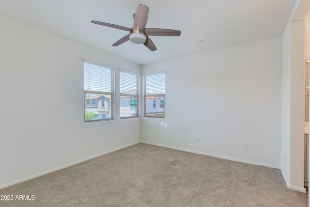 14870 W Encanto Blvd Unit 2006, Goodyear, AZ 85395 - empty room with light carpet and ceiling fan