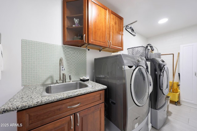 laundry room with cabinet space and washing machine and dryer