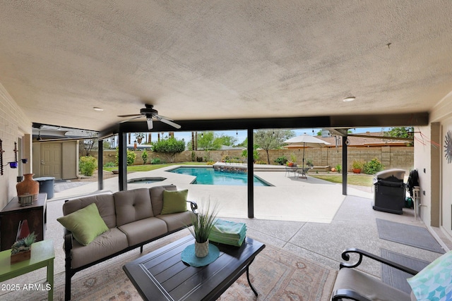view of swimming pool featuring a fenced backyard, a patio, an outdoor living space, and ceiling fan