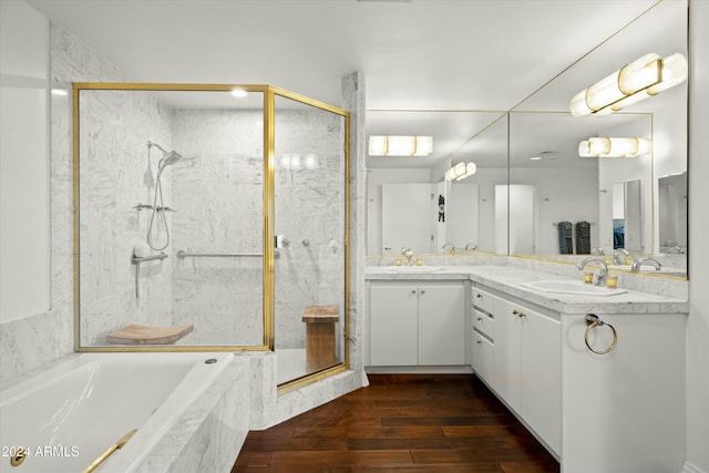 bathroom with vanity, hardwood / wood-style flooring, and separate shower and tub