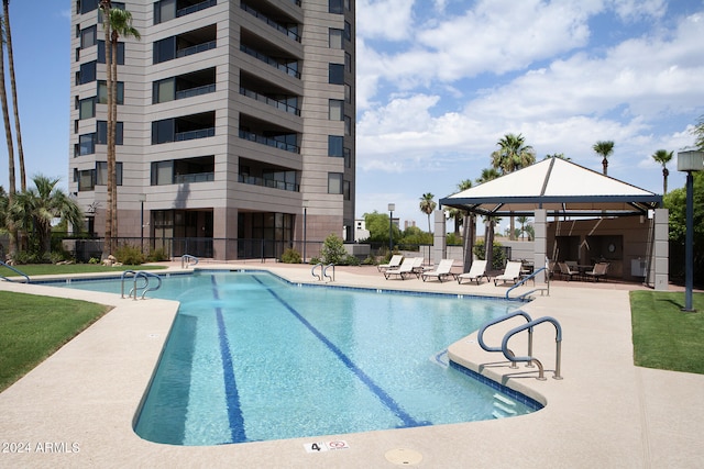 view of swimming pool with a gazebo and a patio