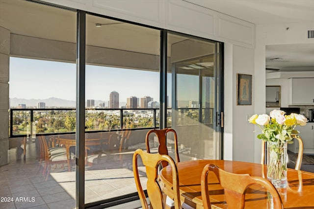 interior space with a mountain view and light tile patterned floors