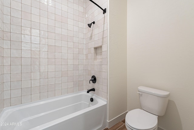 full bath with toilet, shower / bath combination, and baseboards