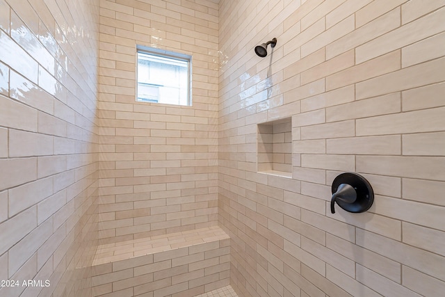 full bathroom featuring a tile shower