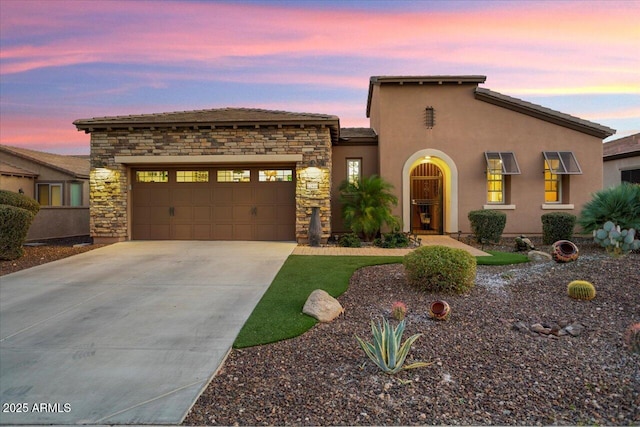 view of front of home with a garage