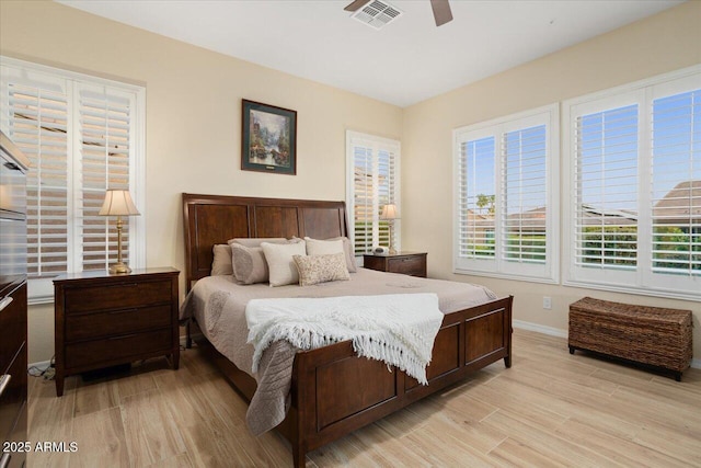 bedroom with ceiling fan and light hardwood / wood-style floors