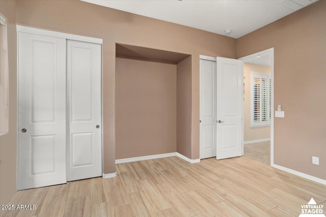 unfurnished bedroom with light wood-type flooring