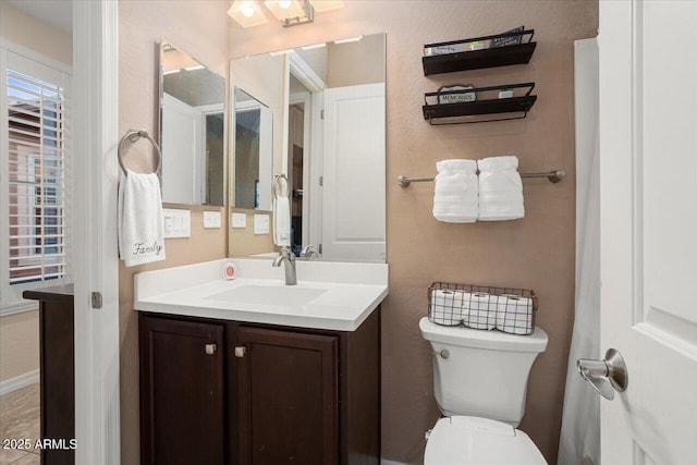 bathroom with vanity and toilet