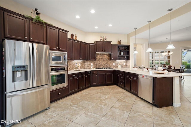 kitchen featuring dark brown cabinets, light tile patterned floors, stainless steel appliances, and decorative light fixtures