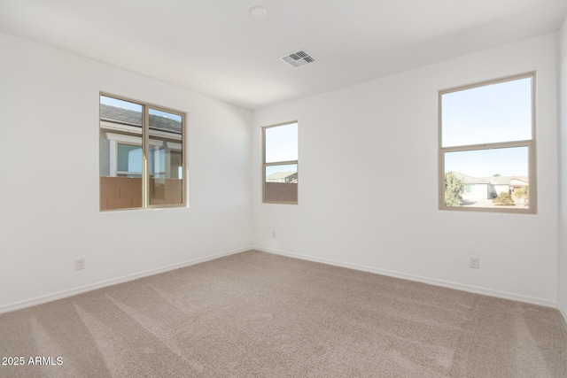 unfurnished room featuring carpet