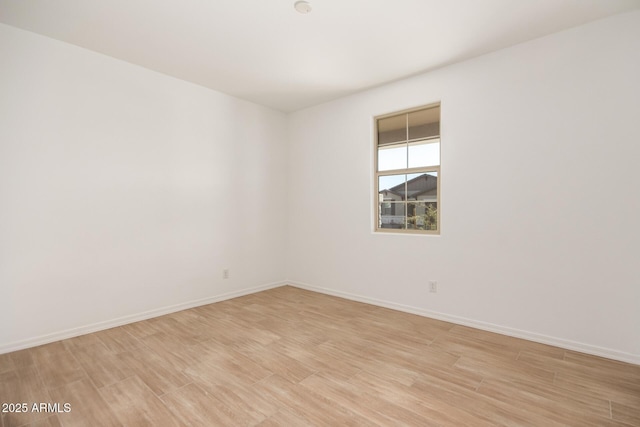 empty room with light hardwood / wood-style floors