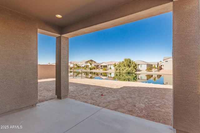 view of patio with a water view