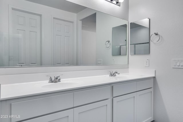 bathroom featuring double vanity