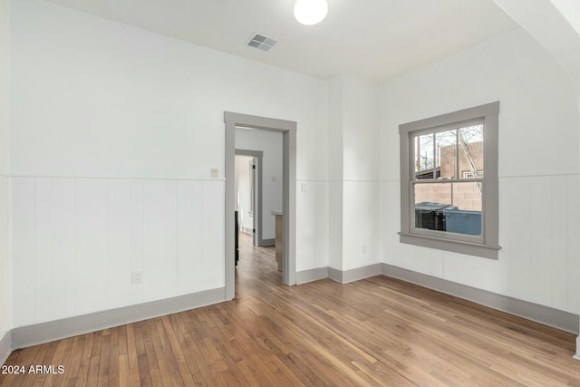 unfurnished room featuring light hardwood / wood-style floors