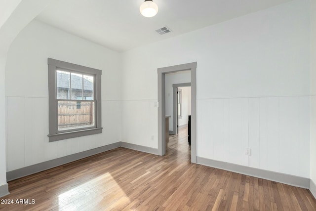 spare room featuring hardwood / wood-style flooring