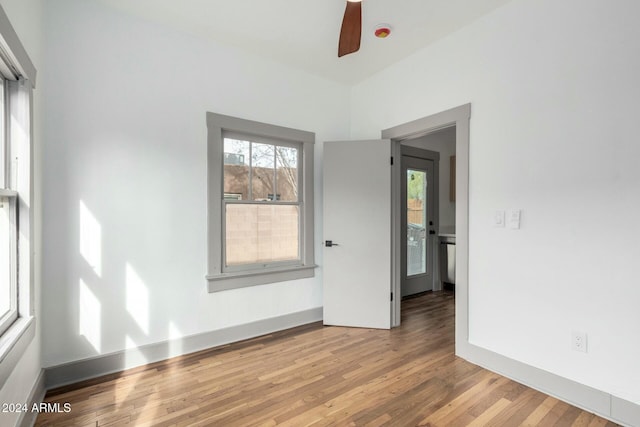 spare room featuring ceiling fan and light wood-type flooring