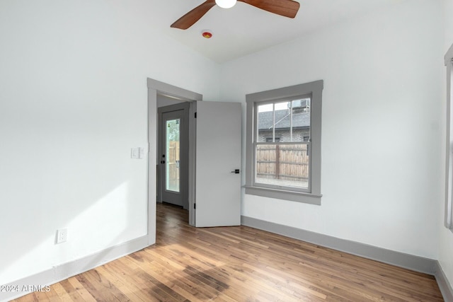 unfurnished room with light hardwood / wood-style flooring and ceiling fan