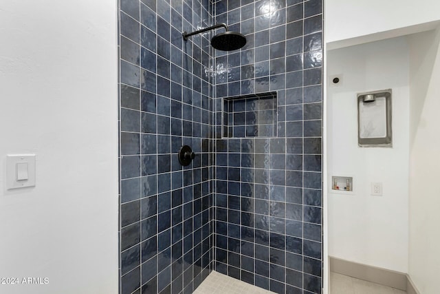 bathroom with tiled shower