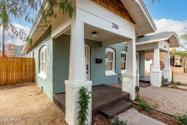 property entrance featuring a porch