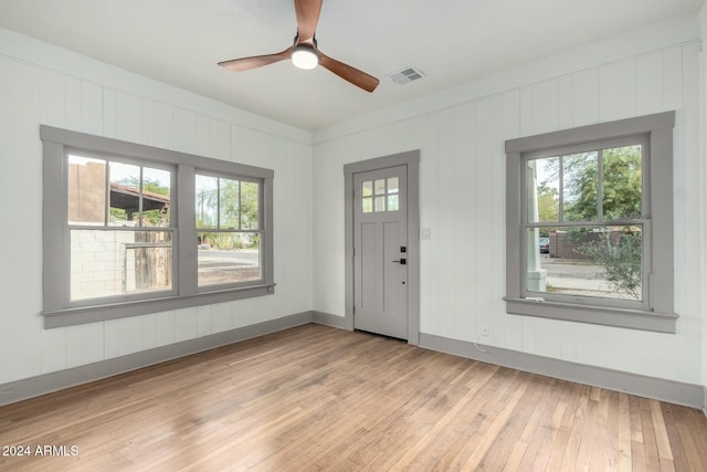 entrance foyer with light hardwood / wood-style flooring and plenty of natural light