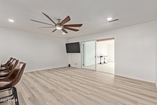 unfurnished office with ceiling fan and light hardwood / wood-style flooring