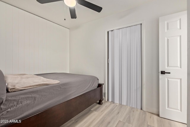 bedroom featuring ceiling fan and light hardwood / wood-style flooring