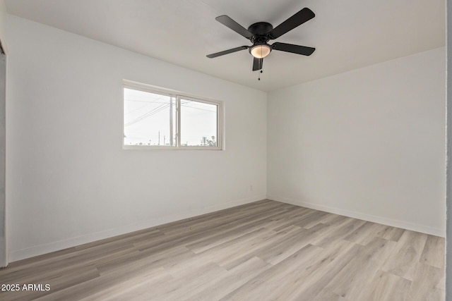 spare room featuring ceiling fan and light hardwood / wood-style floors