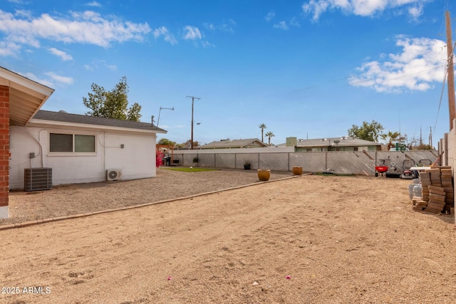 view of yard with central AC