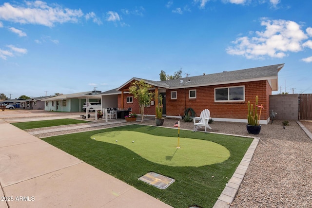 rear view of property featuring a patio area