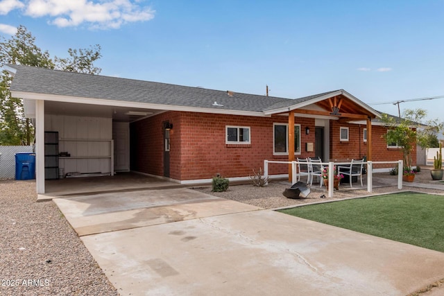 single story home featuring a carport