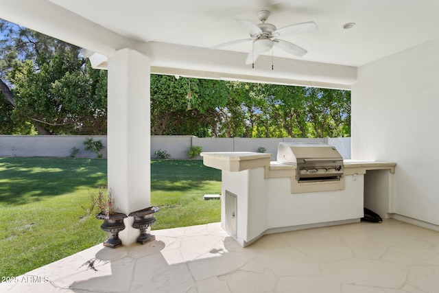 6467 E Sierra Vista Dr, Paradise Valley, AZ 85253 - view of patio / terrace featuring grilling area, an outdoor kitchen, ceiling fan, and a fenced backyard