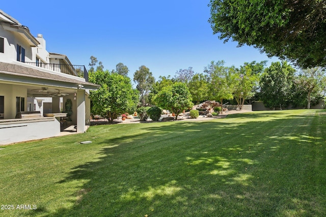 6467 E Sierra Vista Dr, Paradise Valley, AZ 85253 - view of yard featuring a ceiling fan and a balcony