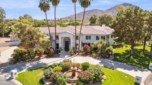 6467 E Sierra Vista Dr, Paradise Valley, AZ 85253 - view of front facade featuring stucco siding, a tile roof, a mountain view, and a front lawn