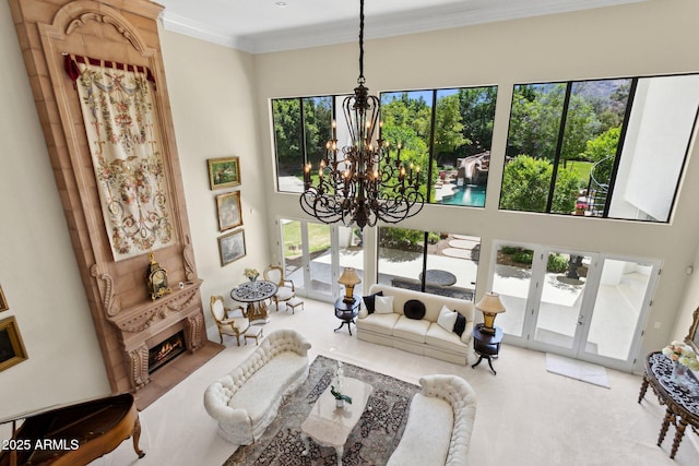 6467 E Sierra Vista Dr, Paradise Valley, AZ 85253 - living room featuring an inviting chandelier, a towering ceiling, carpet floors, and french doors