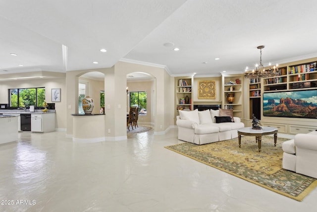 6467 E Sierra Vista Dr, Paradise Valley, AZ 85253 - living room featuring crown molding, arched walkways, recessed lighting, and a healthy amount of sunlight