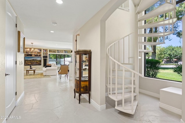 6467 E Sierra Vista Dr, Paradise Valley, AZ 85253 - stairway with baseboards, recessed lighting, and a notable chandelier