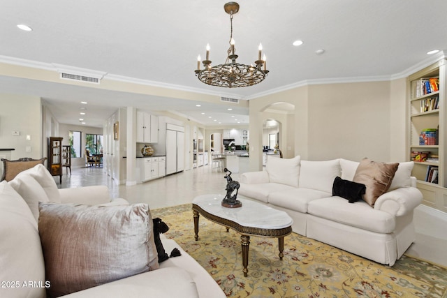 6467 E Sierra Vista Dr, Paradise Valley, AZ 85253 - living room featuring arched walkways, recessed lighting, and visible vents